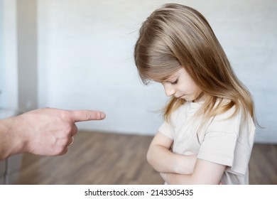 Domestic Violence Concept. Father  Shouting At His Child. Unrecognizable  Man Threatening Daughter With His Fist.