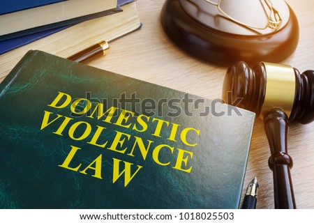 Domestic violence law on a wooden table.