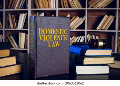 Domestic violence law, pile of books and gavel. - Shutterstock ID 2063562062