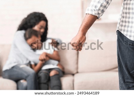 Domestic violence. Mother and daughter suffering from home abusement, mom protecting kid from father's fist.