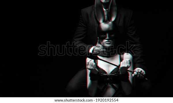 dominant man with a whip Flogger and a submissive\
girl in handcuffs and a face mask. Black and white with 3D glitch\
virtual reality effect