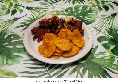 Dominican Cuisine Known As Chicharron De Pollo Con Chuleta Frita Y Tostones