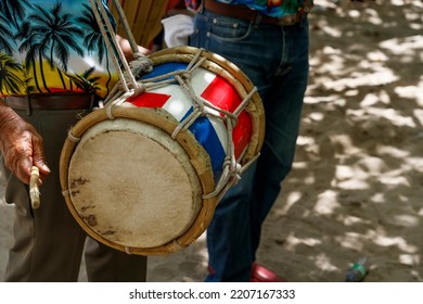 Dominican Republic. The Musician Plays The Drum. Drummer. A Group Of Beach Musicians. Merengue Music.