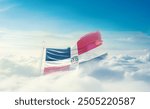 Dominican Republic national flag hidden in the sky. The flag with drone shot in beautiful clouds. Dominican Republic national flag for independence day.