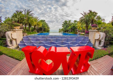 Dominican Republic, Punta Cana, Bavaro - January 5, 2019. Celebration of St. Valentine's Day on the tropical islands. luxury vacation. Inscription love on the background of exotic palms .