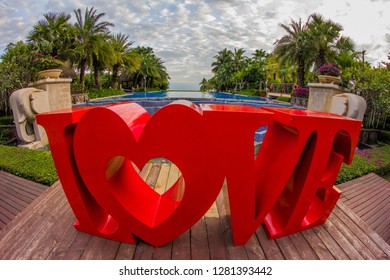 Dominican Republic, Punta Cana, Bavaro - January 5, 2019. Celebration of St. Valentine's Day on the tropical islands. luxury vacation. Inscription love on the background of exotic palms .