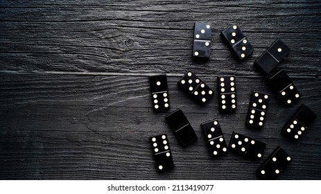 Domino Bones Are On A Black Table