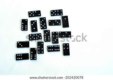 Domino effect concept scattered domino tiles on white background.copyspace