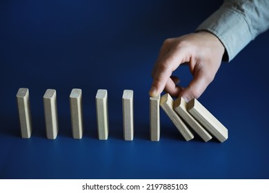 The Domino Effect Stopped By A Unique, One Strong Piece Stop The Falling, Be Stable In Crisis, Business Solution Concept