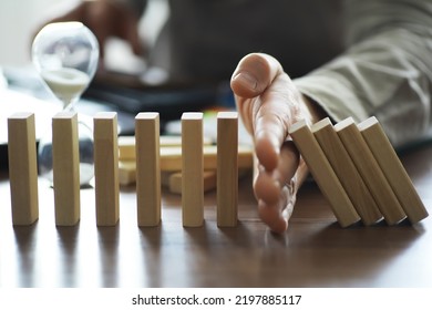 The Domino Effect Stopped By A Unique, One Strong Piece Stop The Falling, Be Stable In Crisis, Business Solution Concept