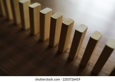 The Domino Effect Stopped By A Unique, One Strong Piece Stop The Falling, Be Stable In Crisis, Business Solution Concept