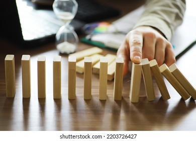 The Domino Effect Stopped By A Unique, One Strong Piece Stop The Falling, Be Stable In Crisis, Business Solution Concept