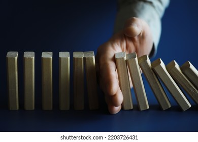 The Domino Effect Stopped By A Unique, One Strong Piece Stop The Falling, Be Stable In Crisis, Business Solution Concept