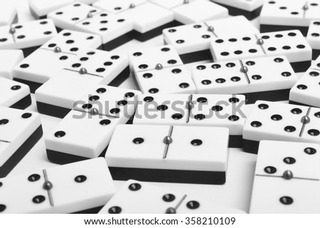 Domino game with pieces over a white background. Black, white. Horizontal