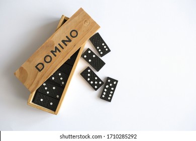 Domino Game In Wooden Box On White Background, Top View. Table Game