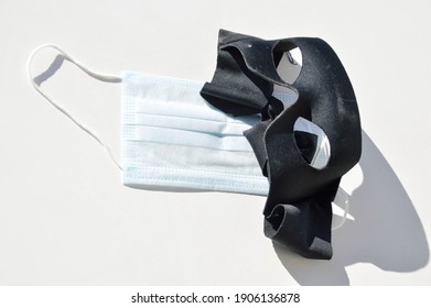 A Domino Mask And A Surgical Face Mask On A White Background