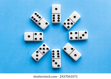 Domino tiles on blue background.