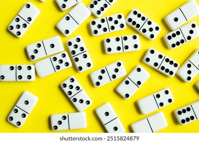 Domino tiles on yellow background.