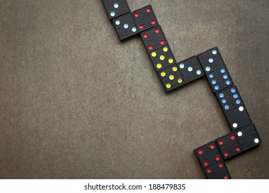 Dominoes On Slate Background.  Overhead View.  Very Old Colorful Set.