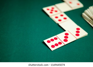 Dominoes Playing Card On Green Color Table