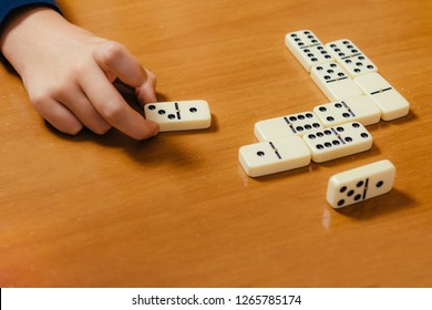 Dominoes. School Boy Playing Dominoes. Having Fun.