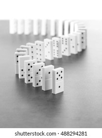 Dominoes Standing On Gray Background