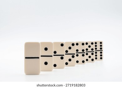 Dominoes tiles ordered progressively representing growth and continuous progress
