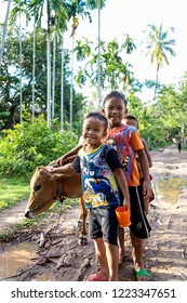 Don Det, Laos. October 23, 2018.
Three kids and a cow - Shutterstock ID 1223347651