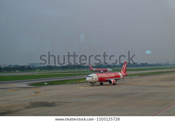 Don Mueang International Airport,\
Thailand-April 12, 2018: air plan airasia on\
runway