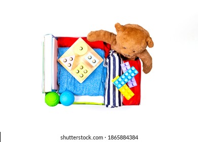 Donation Box With Baby Kid Toys, Books, Clothing For Charity On White Background. Top View