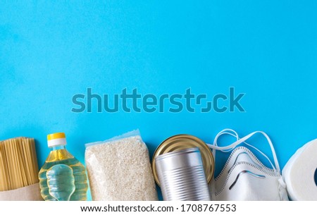 Donation box. Provision of dry rations consisting of vegetable oil, rice, canned food, pasta, bread, toilet paper, protective mask. banner with blank space
