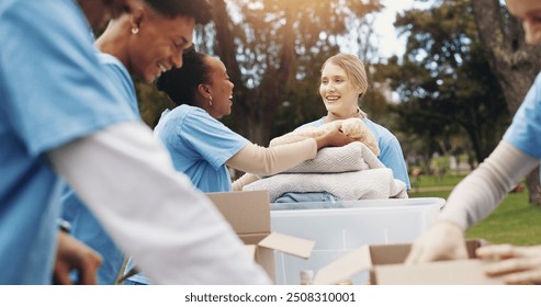 Donation, volunteer and group of people in park together for sustainability, teamwork and ngo project. Solidarity, men and women at table for outdoor charity, community care and social responsibility