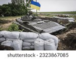 Donbas region, Ukraine - May 19, 2014: BMP-2 infantry fighting vehicle on checkpoint of Armed Forces of Ukraine near Dobropillia during War in Donbas