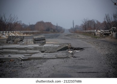 DONBASS, UKRAINE - NOVEMBER 14, 2014: Damaged Road Nearby Ukraine's Eastern Front Lines. The Donbas War Has Raged On Since 2014, Opposing Ukrainian Forces To Pro-Russia Armed Groups.