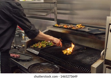 Doncaster, UK - May 11 2019: One Chef Cooking Flame Grilled Steak On A Hot Grill On A Busy Saturday Night Dinner Service At La Boca Argentine Restaurant, 1 Netherhall Road