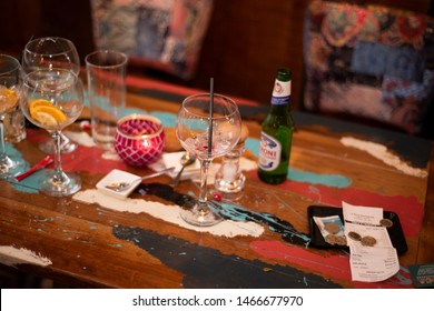 Doncaster, UK - May 11 2019: Empty Glasses And Finished Drinks Lie With The Bill And Tip On A Table At The End Of A Meal On Saturday 11 May At La Boca Restaurant, 1 Netherhall Road