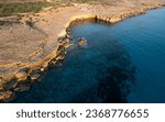 Done scenery of Cape Greko or Cape Greco sea caves Ayia Napa Cyprus. Tourist people doing sightseeing.