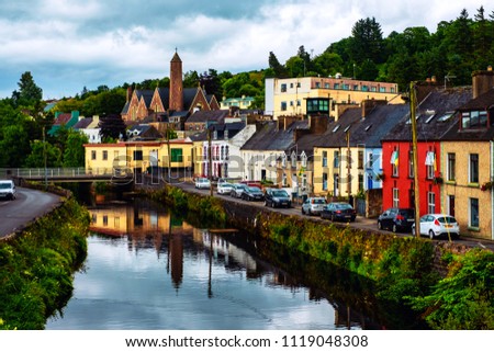 Donegal, Ireland. Beautiful landscape in Donegal, Ireland with river and colorful houses. Cloudy sky in summer, old bridge over the river