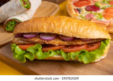 Doner Kebab With Grilled Fish, Shawarma And Pizza On Wooden Tray.