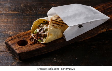 Doner Kebab Gyros Shawarma Beef Roll In Pitta Bread Wrap Sandwich On Wooden Background