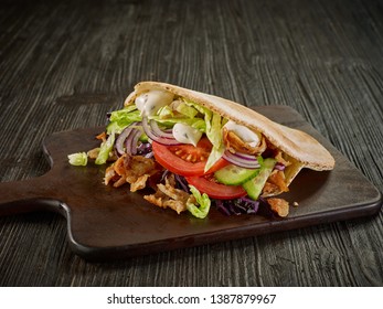 doner kebab on dark wooden kitchen table