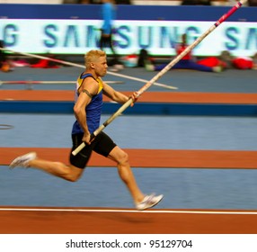 DONETSK, UKRAINE - FEB.11: Denys Yurchenko On The Samsung Pole Vault Stars Meeting On February 11, 2012 In Donetsk, Ukraine. He Won Bronze Medal In The Pole Vault Event At Summer Olympics In Beijing.