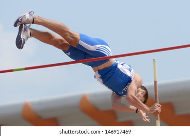 DONETSK, UKRAINE - JULY 12: Petros Hatziou of Greece competes in Pole Vault during 8th IAAF World Youth Championships in Donetsk, Ukraine on July 12, 2013 - Shutterstock ID 146917469