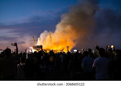 Donggang,Pingtung County,Taiwan,October 31, 2021:A large group of people are watching and filming the traditional folk activities of Pingtung that burn the king boat