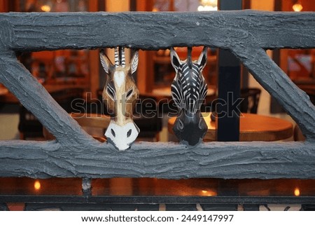 Donkey and zebra mask carved in African style
