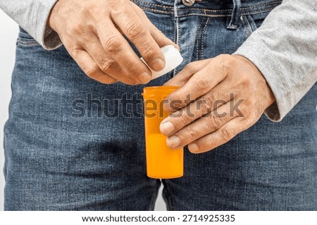 Donor holding container with sperm. Ejaculate human semen in the jar for analysis or testing. Male infertility, In vitro fertilisation IVF. Sperm bank concept. 