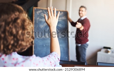 Dont be afraid to ask questions. Shot of an unrecognizable woman raising her hand to ask a question in a meeting.