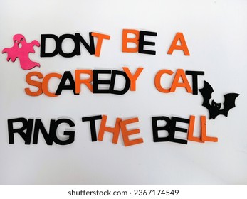don't be a scaredy cat ring the bell Halloween sign with black and orange letters 