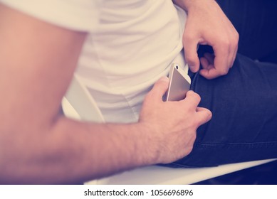 Don't Disturb, Student Putting Phone In Pocket