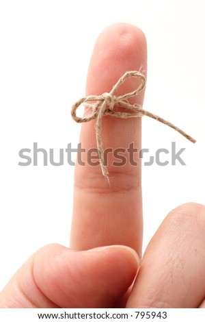 Don't forget, A Close-Up of a Finger with a String Knot as a Symbol for Remembering